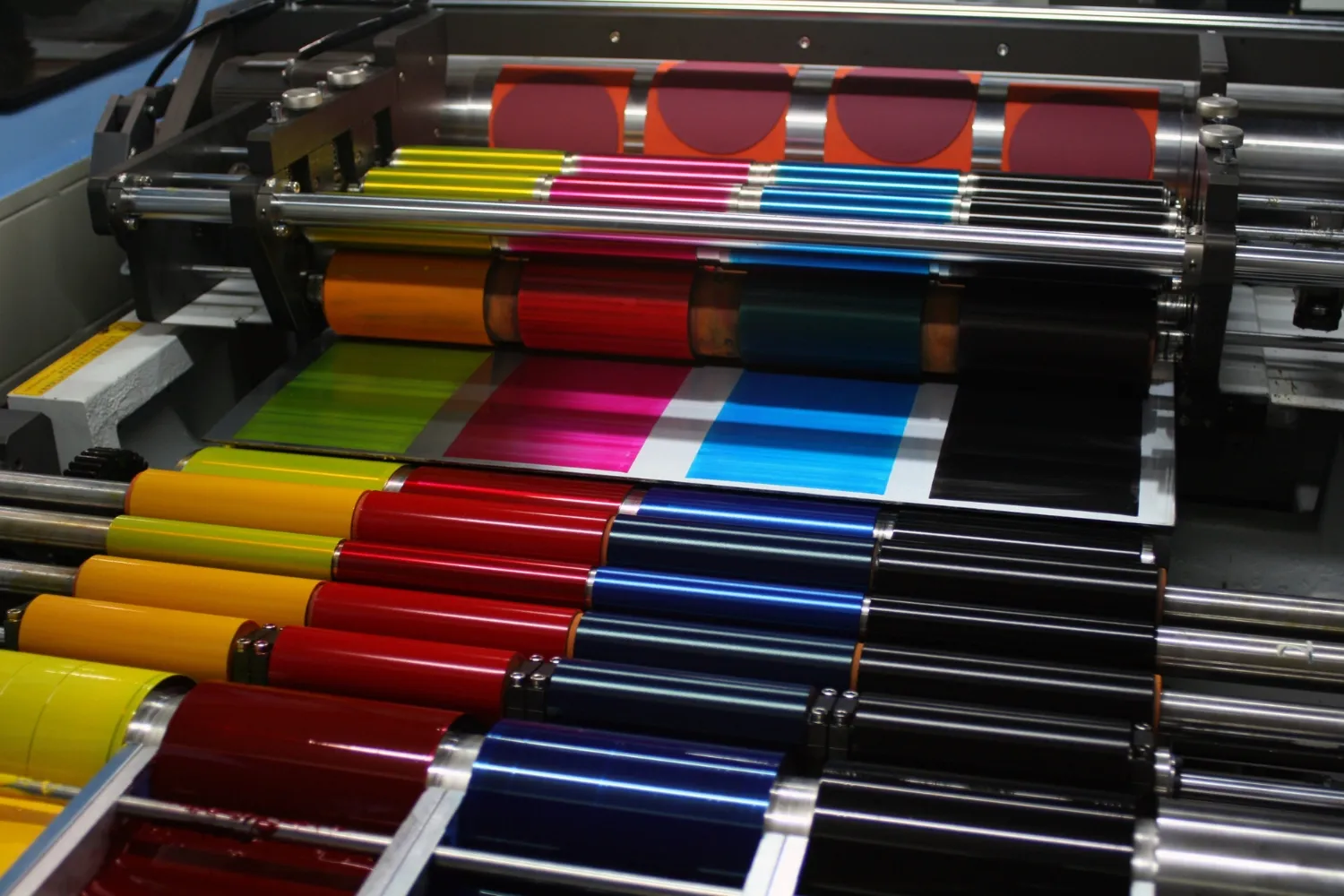 Shades of yellow, pink, blue and blank machine printing ink