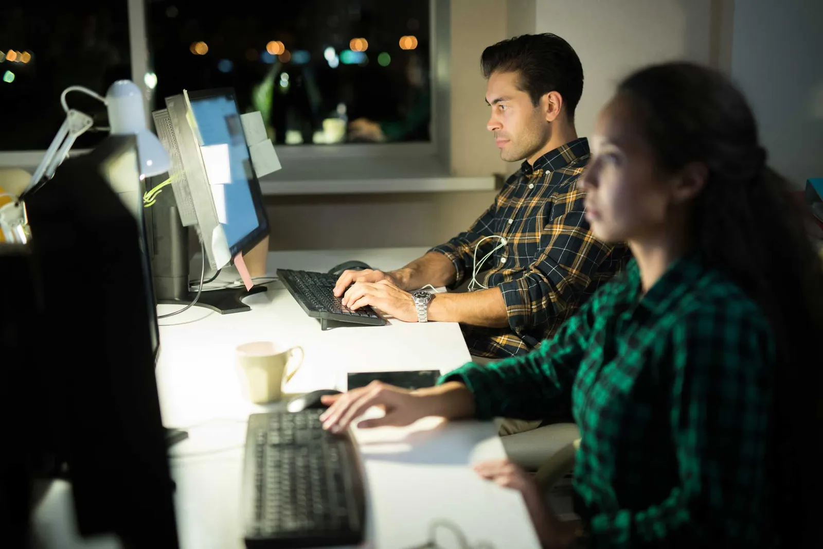 people using computers at work